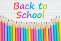 Back to School message with color pencils on vintage ruled line notebook paper Royalty Free Stock Photo