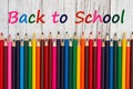 Back to School message with pastel color pencils crayons on wood desk Royalty Free Stock Photo