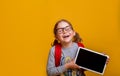 Back to school. Online education concept. Happy child with tablet computer. Kid showing screen. Smiling girl in Royalty Free Stock Photo