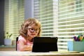 Back to school. Online remote learning. School kids with computer having video conference chat with teacher and class Royalty Free Stock Photo