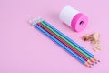 Back to school. Pencils, pencil sharpener on bright pink background. Place for text. Royalty Free Stock Photo