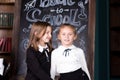 Back to school. Portrait of two girls, first graders.