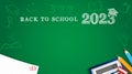 Back to school 2023 poster with pencils, student test and calculator on green blackboard