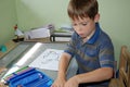 Back to school. Pupil does his homework