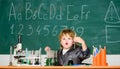 Back to school. Pupil looking through microscope . student do science experiment with microscope in lab. small boy at Royalty Free Stock Photo