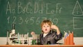 Back to school. Pupil looking through microscope . student do science experiment with microscope in lab. small boy at Royalty Free Stock Photo