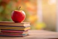 Back to school with a red apple on a stack of books Royalty Free Stock Photo