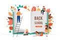 Back to school scene with big book and miniature people, children playing with autumn leaves, jumping and running