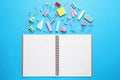 Back to school. School stationery and paper planes near notebook on light blue background, flat lay Royalty Free Stock Photo