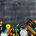 Back to school. School supplies on the background of the blackboard ready for your design. Copy space for text Royalty Free Stock Photo