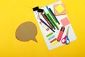 Back to school, school supplies and chat cardboard bubble on a yellow background. Protection of schoolchildren and students from t