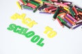 Back to school ,School supplies colored pencils in Fall scattered, isolated Royalty Free Stock Photo