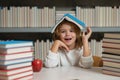 Back to school. Schoolboy reading book in library. Kids development, learn to read. Pupil reading books in a school Royalty Free Stock Photo