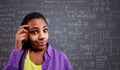Back to school- schoolgirl have problem with formulas Royalty Free Stock Photo
