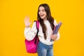 Back to school. Schoolgirl student hold book on yellow isolated studio background. School and education concept Royalty Free Stock Photo