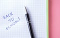 Back to school setup in pink and green colors with notebook and pen Royalty Free Stock Photo