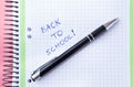Back to school setup in pink and green colors with notebook and pen Royalty Free Stock Photo