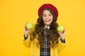 Back to school snack. Happy child hold natural apples yellow background. Promote natural healthy food at school. Natural