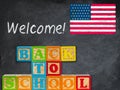 Back to School spelled out in wooden blocks with chalkboard Royalty Free Stock Photo