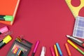 Back to school. Stationery on a Burgundy table. Office desk with copy space. Flat lay Royalty Free Stock Photo