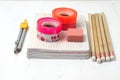 Basic stationery - notebooks, pencils, tapes, compass, gum