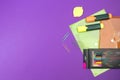 Back to school. Stationery on a Purple table. Office desk with copy space. Flat lay