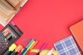 Back to school. Stationery on a red table. Office desk with copy space. Flat lay Royalty Free Stock Photo