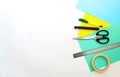 Back to school. stationery, school supplies: colored paper, scissors, ruler, marker on a white background. view from above