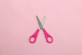 back to school. stationery, school supplies, scissors on a bright pink background. top view. minimalism concept