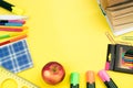 Back to school. Stationery on a yellow table. Office desk with copy space. Flat lay