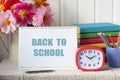 Back to school. still life with bouquet of dahlias and textbooks Royalty Free Stock Photo