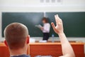 Back to school. Student with arm raised. Royalty Free Stock Photo