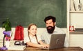 Back to school. study online. small child with bearded teacher man use laptop. innovative technology in modern school