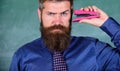 Back to school and studying. Teaching memorization techniques. Teacher bearded man with pink stapler chalkboard