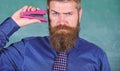 Back to school and studying. Teaching memorization techniques. Teacher bearded man with pink stapler chalkboard