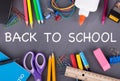 Back To School Supplies on a Blackboard Royalty Free Stock Photo