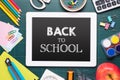 Back to school supplies. Books and chalkboard. Royalty Free Stock Photo