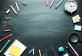 Back to school supplies and office accessories on blackboard background.top view Royalty Free Stock Photo