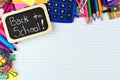 Back to School tag with school supplies on graphing paper Royalty Free Stock Photo