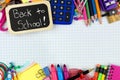 Back to School tag with school supplies on graphing paper Royalty Free Stock Photo