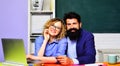 Back to school. Teachers day. Smiling teachers couple in classroom college. Teacher man and woman in university campus Royalty Free Stock Photo