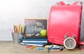 Back to school text on black chalk board with bag Royalty Free Stock Photo