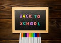 Back to school text colorful letters on blackboard