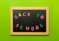 Back to school text colorful letters on blackboard