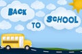 Back to school text on a Landscape with School bus, road, sun and clouds. Blue background Royalty Free Stock Photo