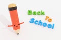Back to school text with pencil cartoon character. Royalty Free Stock Photo