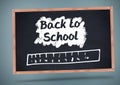 Back to school text with ruler on blackboard
