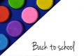 Back to school text and watercolors in the corner