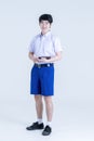 Back to school. Thai students with tablet. Boy standing and using digital tablet Royalty Free Stock Photo