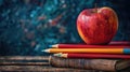 Back to School: Apple, Books, Pencils, and Empty Blackboard Royalty Free Stock Photo